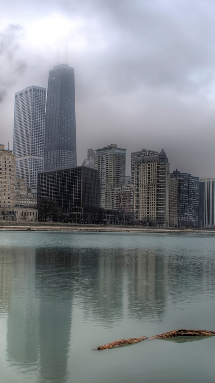 Обои отражение, город, небоскреб, вода, линия горизонта в разрешении 750x1334