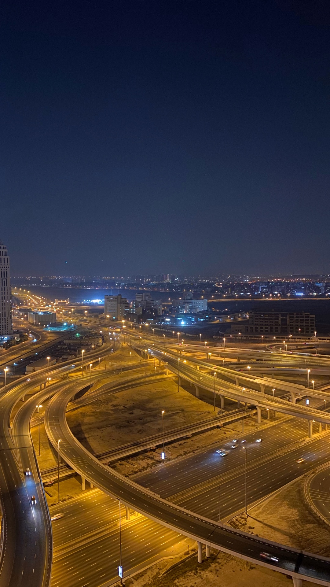 Обои Дубай, дорога, ночь, городской район, город в разрешении 1080x1920