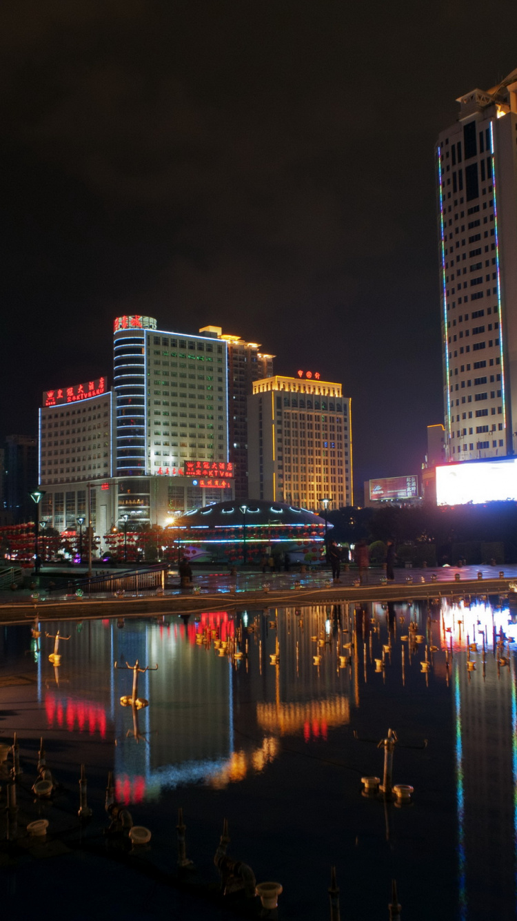 Обои небоскреб, ночь, город, городской пейзаж, метрополия в разрешении 750x1334