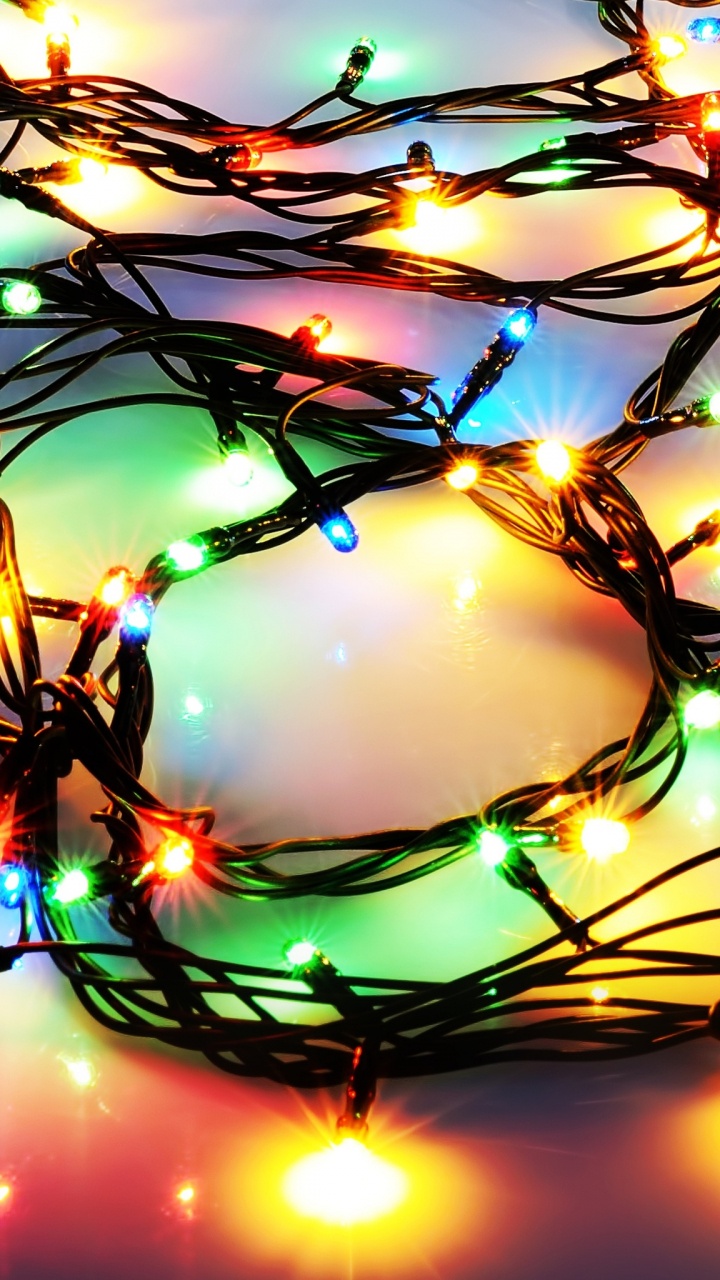 Обои Рождественские огни, Рождественский день, освещение, свет, ветвь в разрешении 720x1280