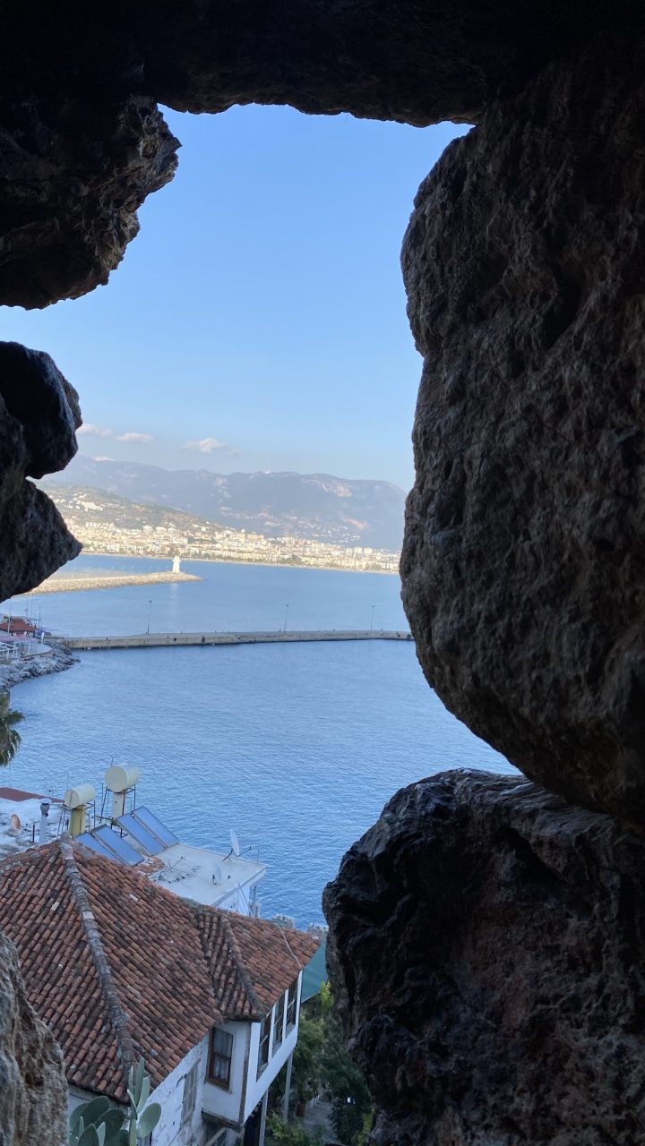 Обои море, естественная арка, морская пещера, вода, растение в разрешении 720x1280