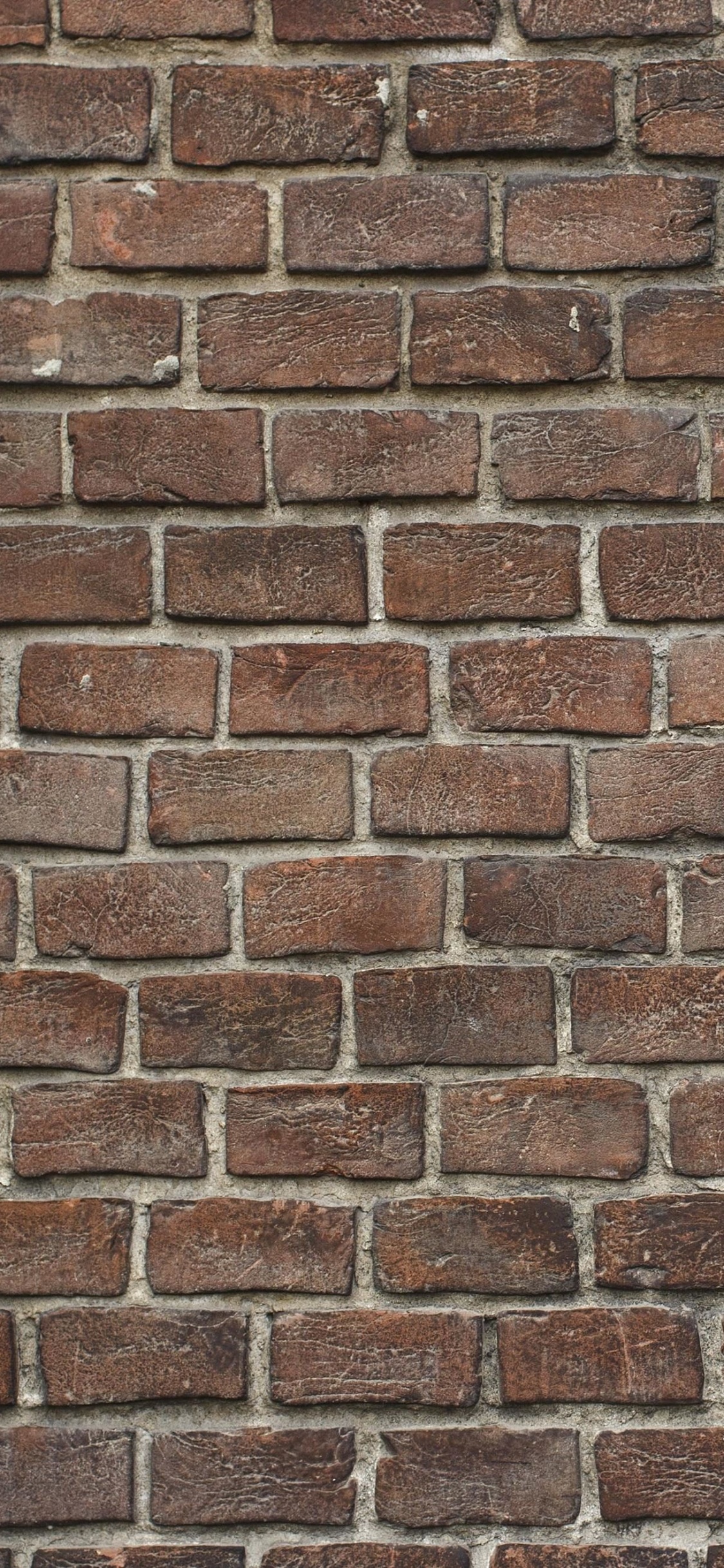 Обои каменная стена, стена, кирпичная кладка, кирпич, каменщик в разрешении 1125x2436