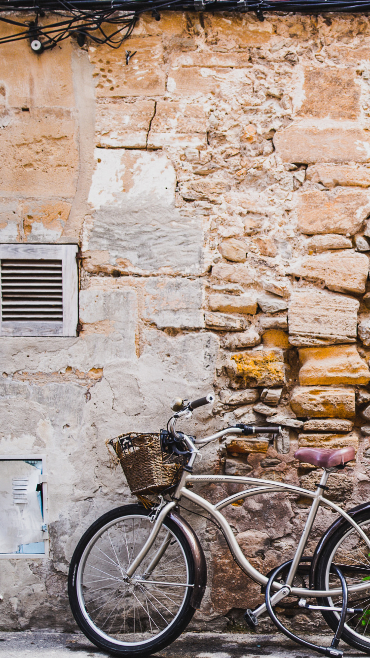 Обои стена, велосипед, улица в разрешении 750x1334