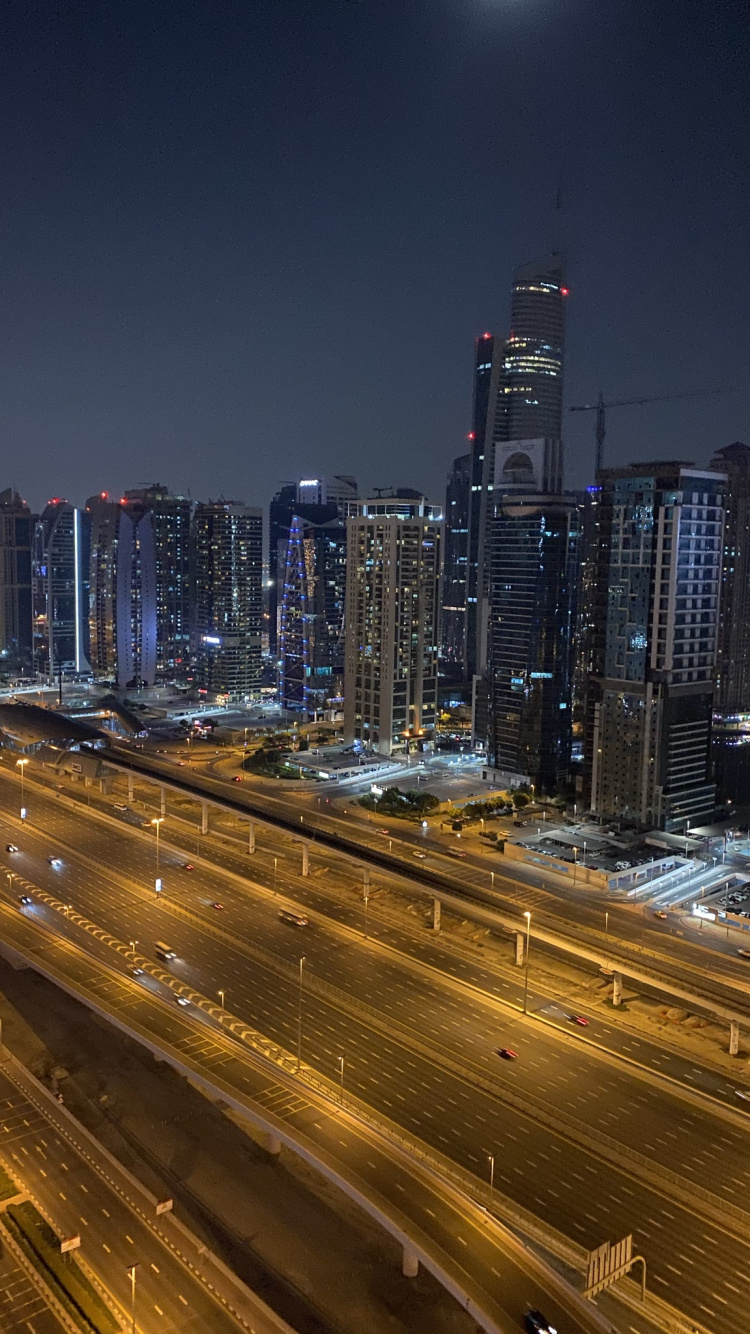 Обои Дубай, ночь, дорога, город, городской район в разрешении 750x1334